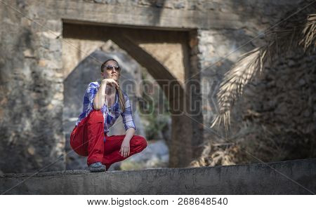 Hiker In An Old Omani Garden In An Old Village Of Misfat Al Abriyeen
