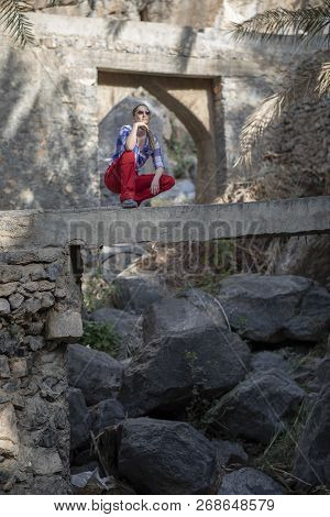 Hiker In An Old Omani Garden In An Old Village Of Misfat Al Abriyeen