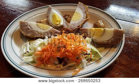 Scottish Food Sausage Meat With Eggs And Carrot Salad
