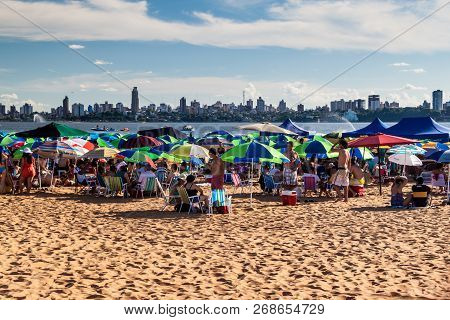 Encarnacion, Paraguay - Feb 7, 2015: People On A Beach At River Parana In Encarnacion City.