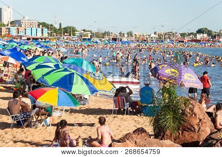 Encarnacion, Paraguay - Feb 7, 2015: People On A Beach At River Parana In Encarnacion City.