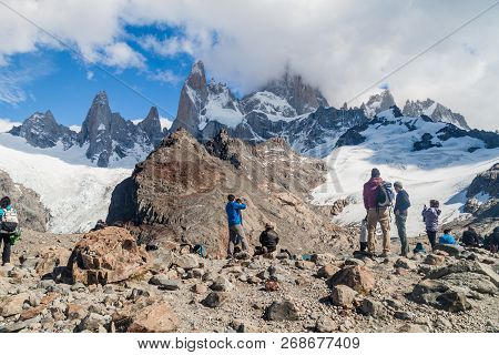 El Chalten, Argentina - March 11, 2015: Tourists Near Laguna De Los Tres Lake Observe Fitz Roy Mount
