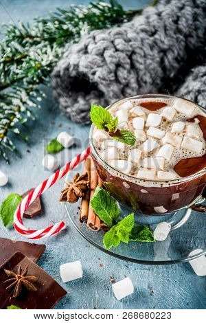Homemade Hot Chocolate With Mint, Candy Cane And Marshmallow, Light Blue Background With Warm Blanke