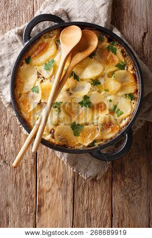 Janssonin Kiusaus Four Ingredient Finnish Potato Bake Closeup On The Table. Vertical Top View