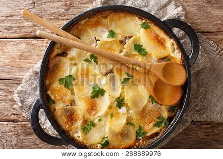 Finnish Cuisine Janssonin Kiusaus. Baked Potatoes With Anchovies, Onions And Cream Close-up In A Fry