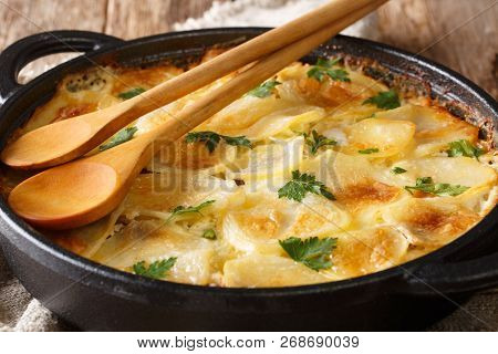 Finnish Janssonin Kiusaus Hot Baked Potatoes With Anchovies, Onions And Heavy Cream Close-up In A Fr