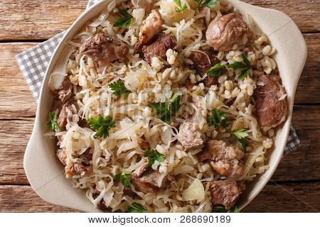 Rustic Style Estonian Mulgikapsas Stewed Pork With Sauerkraut, Onions And Barley Closeup In A Dish.