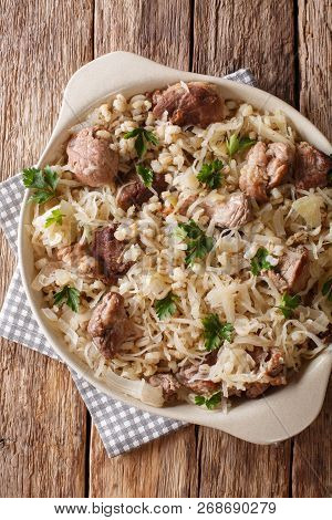 Traditional Estonian Festive Dish Of Pork, Barley And Sauerkraut Closeup On The Table. Vertical Top