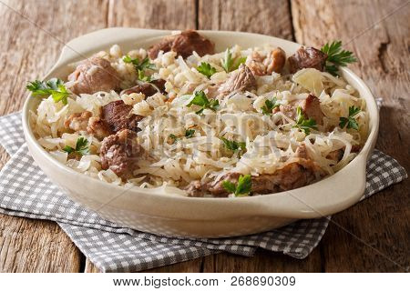 Estonian Main Course Mulgikapsas Cooked Pork With Sauerkraut, Onions And Barley Closeup In A Dish. H