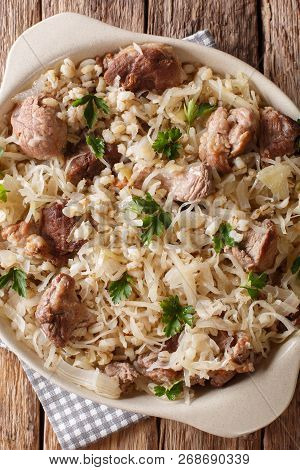 Rustic Style Estonian Mulgikapsas Stewed Pork With Sauerkraut, Onions And Barley Closeup In A Dish.