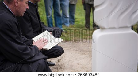 quran holy book reading by imam  on islamic funeral with white thumb stones graweyard background