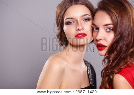 Two Young Beauty Women Standing Together . Two Young Beauty Wome
