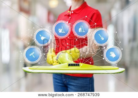 A Worker Of Cleaning Service Is Holding A Mop With A Digital System Of Spheres Containing Different 