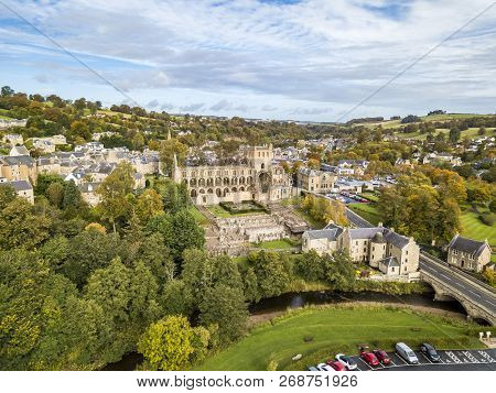 Aerial View Of Jedburgh In Autumn With The Ruins Of Jedburgh Abbey In Scotland