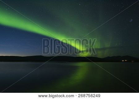 Landscape With Aurora Borealis And Tornetrask Lake. Northern Sweden