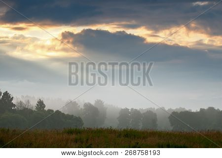 Beautiful Landscape With Mist. Summer Beautiful Idyllic Landscape In Latvia. Meadow, Wood And Sky Wi