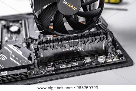Uzhgorod, Ukraine - October 25, 2018: Installing Random Access Memory Kingston Ddr4 Hyperx Predator 