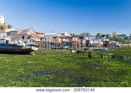 Castro, Chile - March 23, 2015: Fishing Boats And Palafitos Stilt Houses During Low Tide In Castro, 