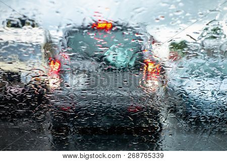 The Car In A Reverse Gear Braking And Paying Attention When Parking To Prevent An Accident In A Bad 