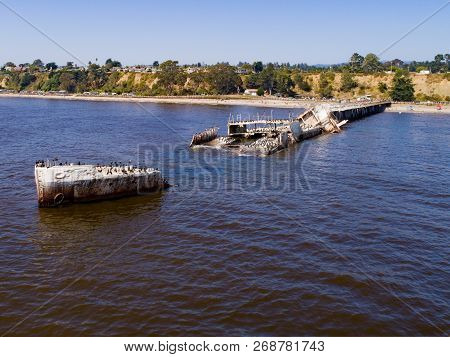 An Aerial Shot Of A Beached Cement Ship