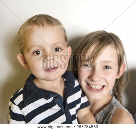 Happy Children Sister The Girl Holding His Brother