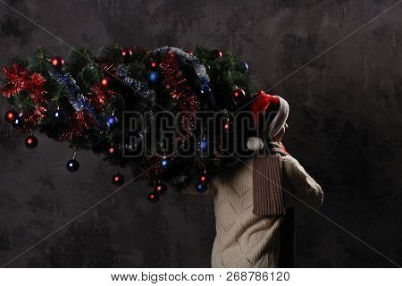 Christmas Gift Concept. Man In Santa Hat Bring Gift For You. Attractive Man Hold Box.  Christmas And