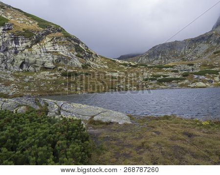 Pleso Nad Skokom, Beautiful Mountain Lake In Mlynicka Dolina Valley With Hiking Peoples On Footpath 
