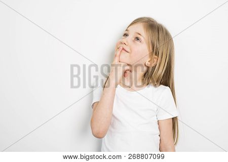 Happy Small Five Years Old Girl With Straight Hair Over White Background At Home