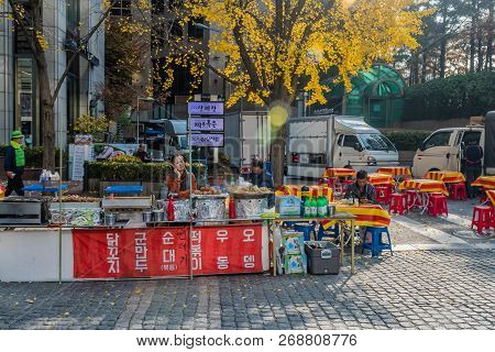 Seoul, South Korea; November 10, 2018: Unidentified Street Food Vendor Waits Patiently For Customers