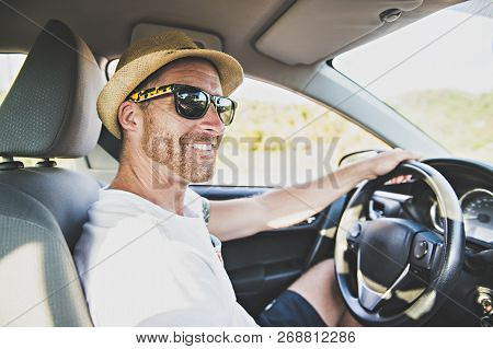 Men Sitting In A Rental Car On Holiday Vacancy With Sunglasses