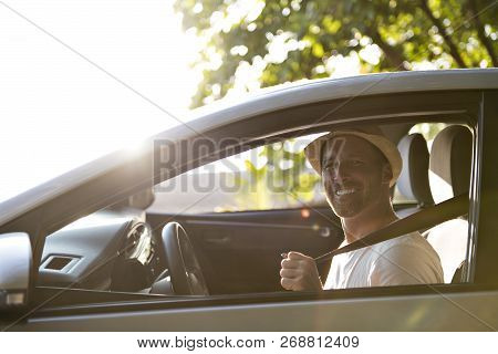 Men Sitting In A Rental Car On Holiday Vacancy