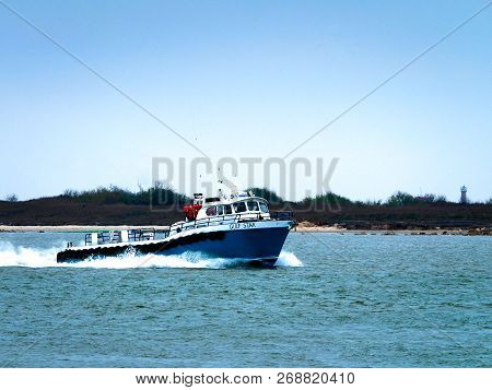 Port Aransas, Tx - February 8, 2018: Fishing Boat Trawler Heading Out Channel To Gulf Of Mexico