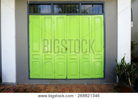 Brilliant Chartreuse Green Wood Paneled Doors In Luang Prabang, Laos, Horizontal Architecture Backgr