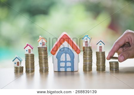 Hand Putting Money Coin Stack With Small House, Purchase Of Habitation, Buy A House,risk, Assets, Pr