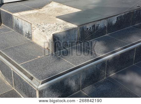 Broken Tiles On Entance Door Steps. Close Up