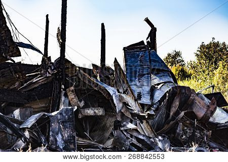 Damaged Industry Supermarket After Arson Fire With Burn Debris Of Twisted Metallic Wood Structure Af