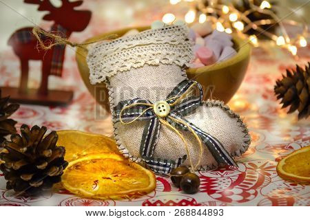 Christmas And New Year's Winter Holiday Christmas Stocking On The Table. Composition. Garland, Deer 