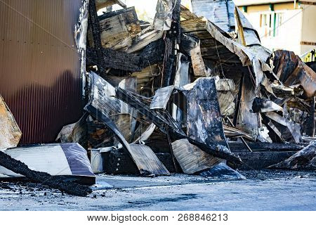 Damaged Industry Supermarket After Arson Fire With Burn Debris Of Twisted Metallic Wood Structure Af