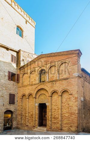 View At Facade Of Church Of San Bartolo In The Streets Of San Gimignano In Italy,tuscany