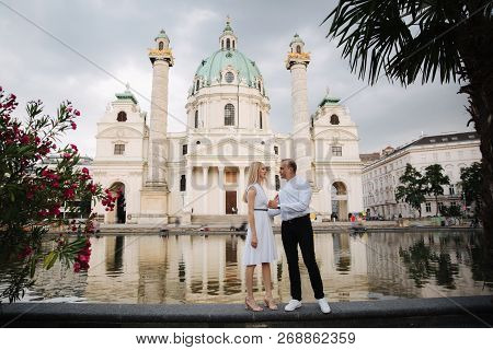 Happy Couple Walking In The Austria, Viena. They Love Each Other And Spent Time Together