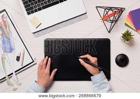 Office Desk With Cropped Peson Using Graphics Tablet And Pen, Flat Lay