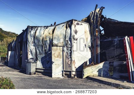 Damaged Industry Supermarket After Arson Fire With Burn Debris Of Twisted Metallic Wood Structure Af