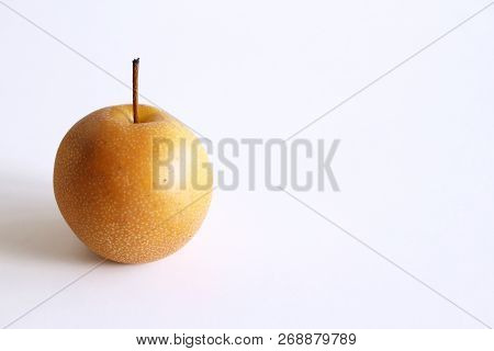 Whole Chinese Pear Or Nashi Pear With Stem On White Background. Food Concept.