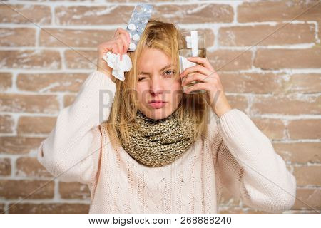 What To Know About Breaking Fever. Woman Tousled Hair Scarf Hold Glass Water And Tablets Blister. Gi