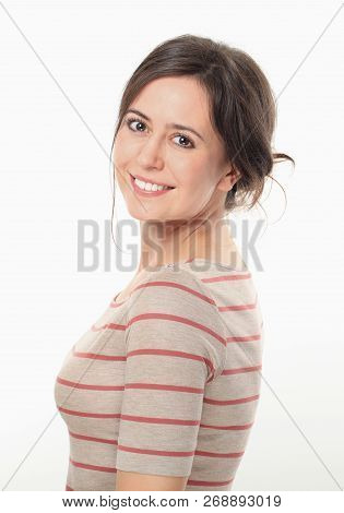 Young Brunette Woman Smiling And Posing Side To Camera