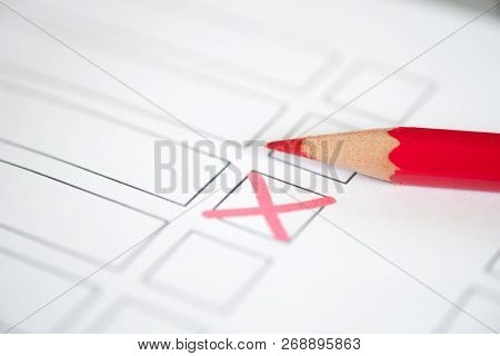 Close Up Voting Bulletin With Red Pencil. Concept Of Election. Photo With Shallow Depth Of Field