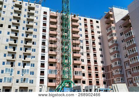 Modern Construction Site Of Building With Crane