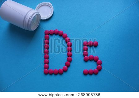 Pink Round Pills Lined With The Letter D5