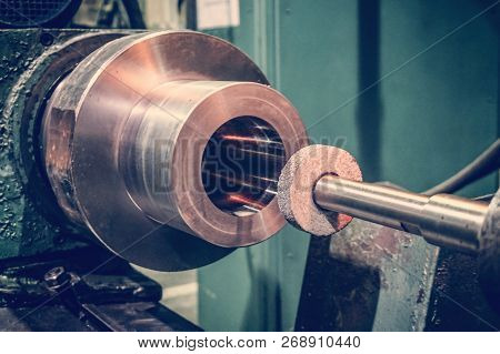 Abrasive Wheel On The Mandrel On The Machine In Front Of The Cylindrical Part Is Ready For Metal Pro