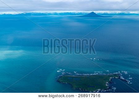 Teal Waters Of Alaska Near Katmai National Park, With View Of Augustine Island And The Aleutian Rang